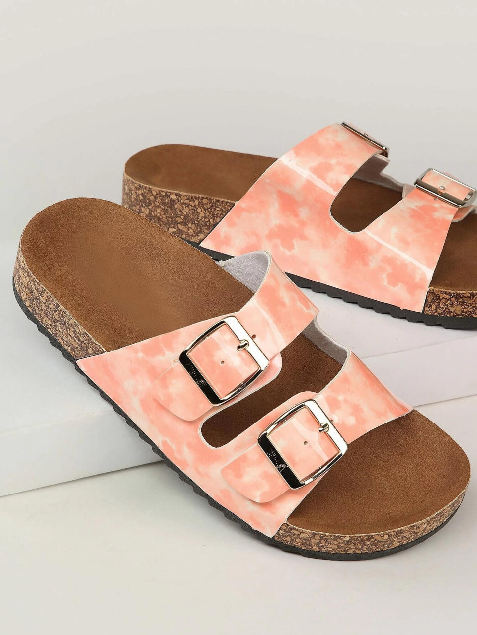 Yes, Birkenstock dupes can get the tie-dye treatment, as this pink pair features the much-loved print on the upper part of the shoe. <br /><br /><a href="https://yhoo.it/38oUUWX" target="_blank" rel="noopener noreferrer"><strong>Shein Lightweight Cork Platform, $23</strong></a>