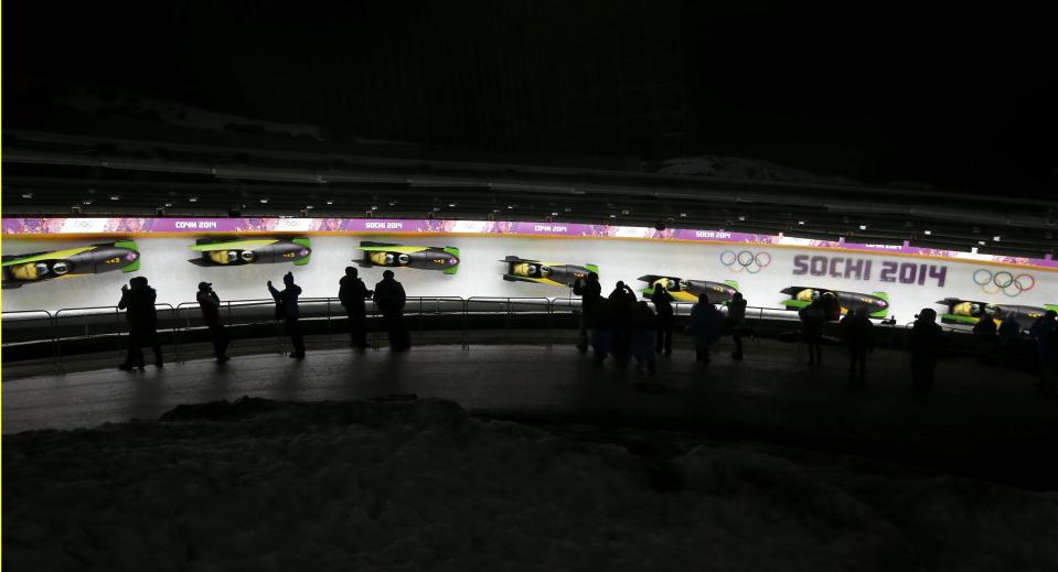 Jamaica's Winston Watts and Marvin Dixon speed down the track during the two-man bobsleigh event at the 2014 Sochi Winter Olympics, at the Sanki Sliding Center in Rosa Khutor February 16, 2014. Picture taken with multiple exposure. REUTERS/Fabrizio Bensch (RUSSIA - Tags: SPORT BOBSLEIGH OLYMPICS)