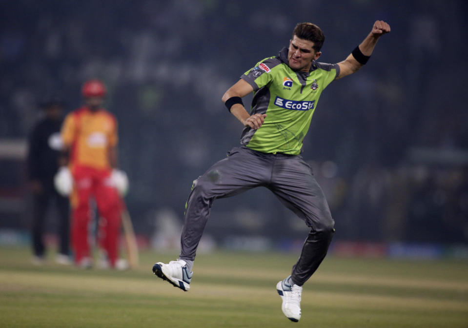 Lahore Qalandars pacer Shaheen Shah Afridi celebrates after taking the wicket of Islamabad United batsman Asif Ali during their Pakistan Super League T20 cricket match at Gaddafi stadium in Lahore, Pakistan, Sunday, Feb. 23, 2020. (AP Photo/K.M. Chaudary)