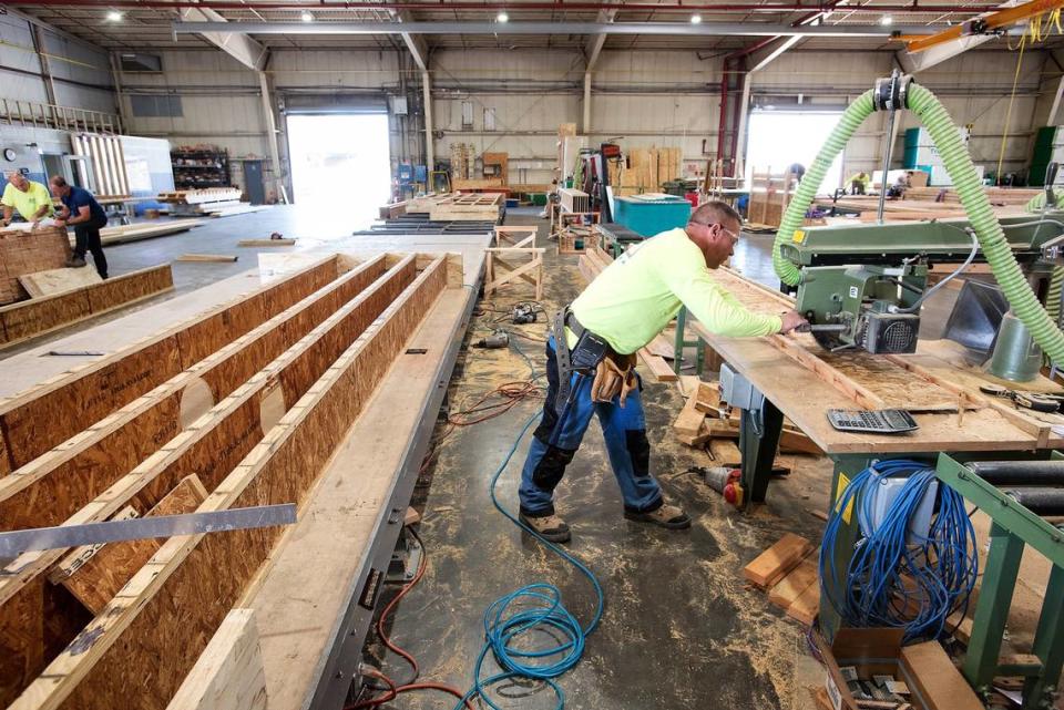 Colm McErlain cuts section for a floor panel at the Entekra manufacturing facility in Ripon, Calif., Thursday, May 24, 2018.