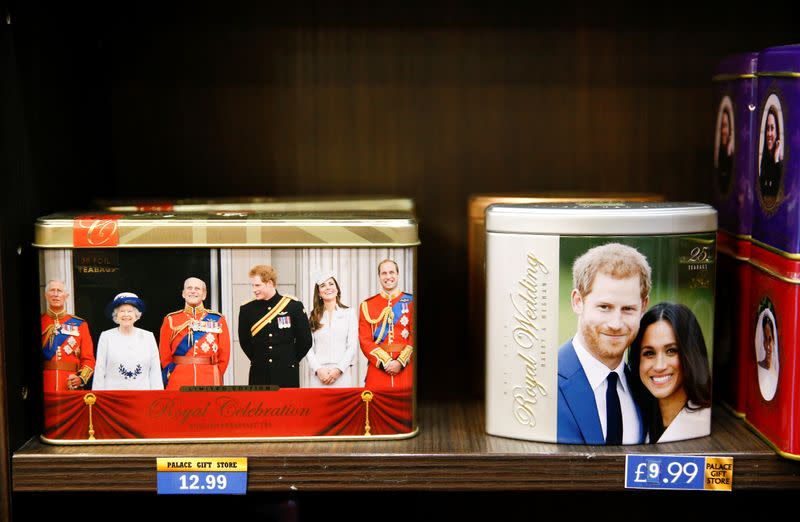 Merchandise depicting Britain's Prince Harry and Meghan, Duchess of Sussex, are seen on display in a souvenir shop near Buckingham Palace in London