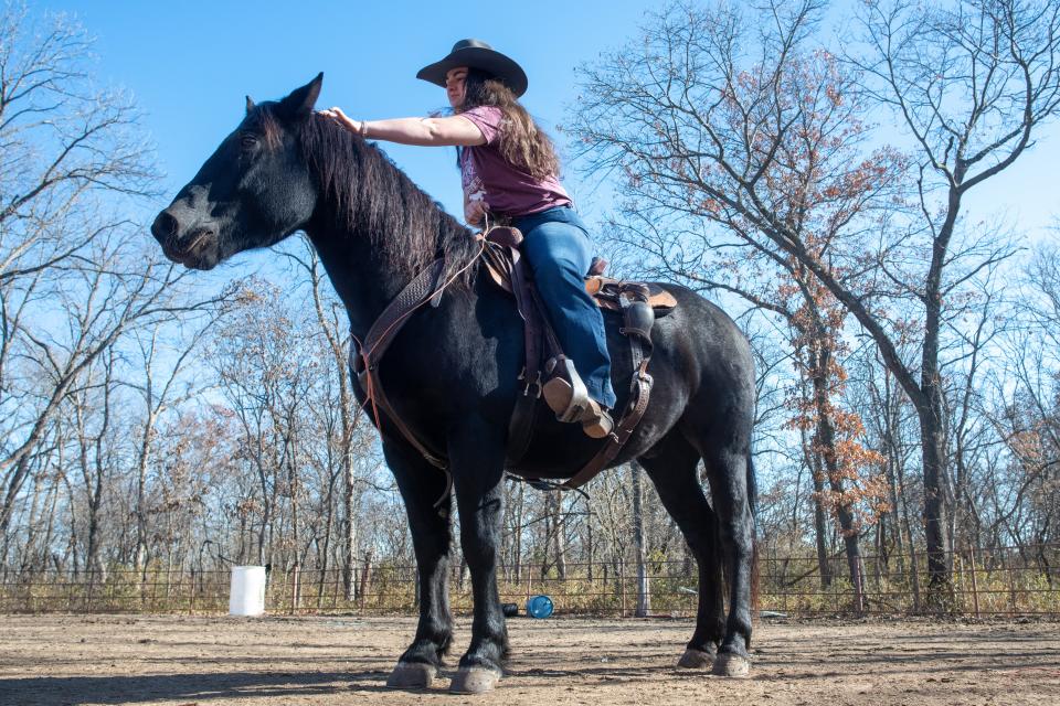 Giving Samson some head scratches Friday, Angeline Saliceti said the black stallion was born in Wyoming and saddle-trained by inmates at the Hutchinson Correctional Facility.