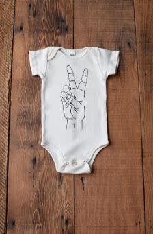 This Oregon-based Amazon Handmade shop specializes in screen-printed home goods. Find this <a href="https://amzn.to/2VxkW5b" target="_blank" rel="noopener noreferrer">organic baby peace sign onesie</a> for $26.