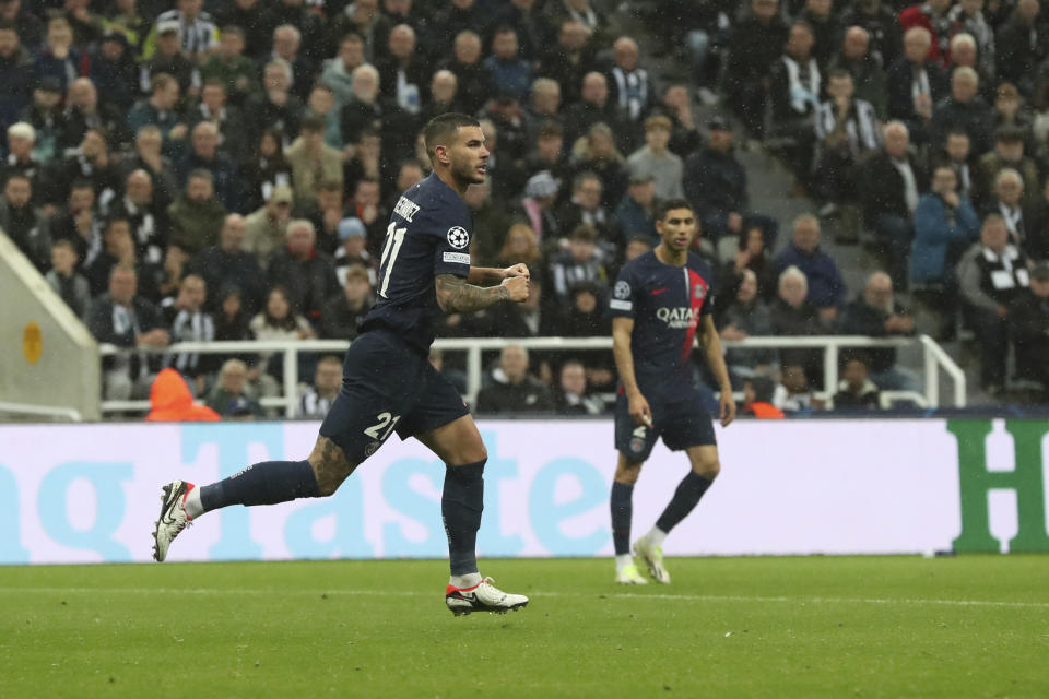 PSG's Lucas Hernandez celebrates after scoring his side's first goal during the Champions League group F soccer match between Newcastle and Paris Saint Germain at St. James' Park, Wednesday, Oct. 4, 2023, in Newcastle, England. (AP Photo/Scott Heppell)