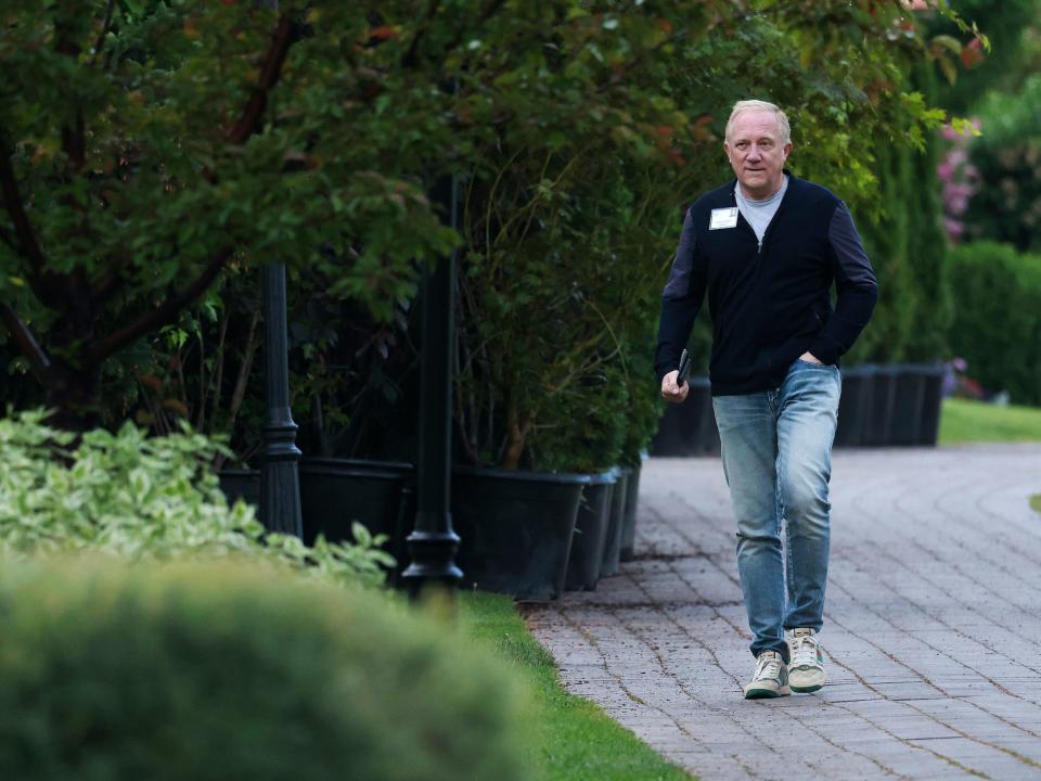 Francois-Henri Pinault, Kering CEO, walks on sidewalk at Sun Valley resort