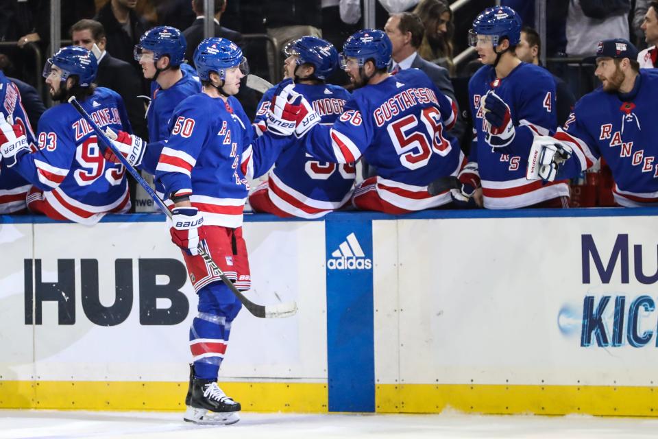 Nov 2, 2023; New York, New York, USA; New York Rangers left wing Will Cuylle (50) celebrates with his teammates after scoring a goal in the third period against the Carolina Hurricanes at Madison Square Garden. Mandatory Credit: Wendell Cruz-USA TODAY Sports