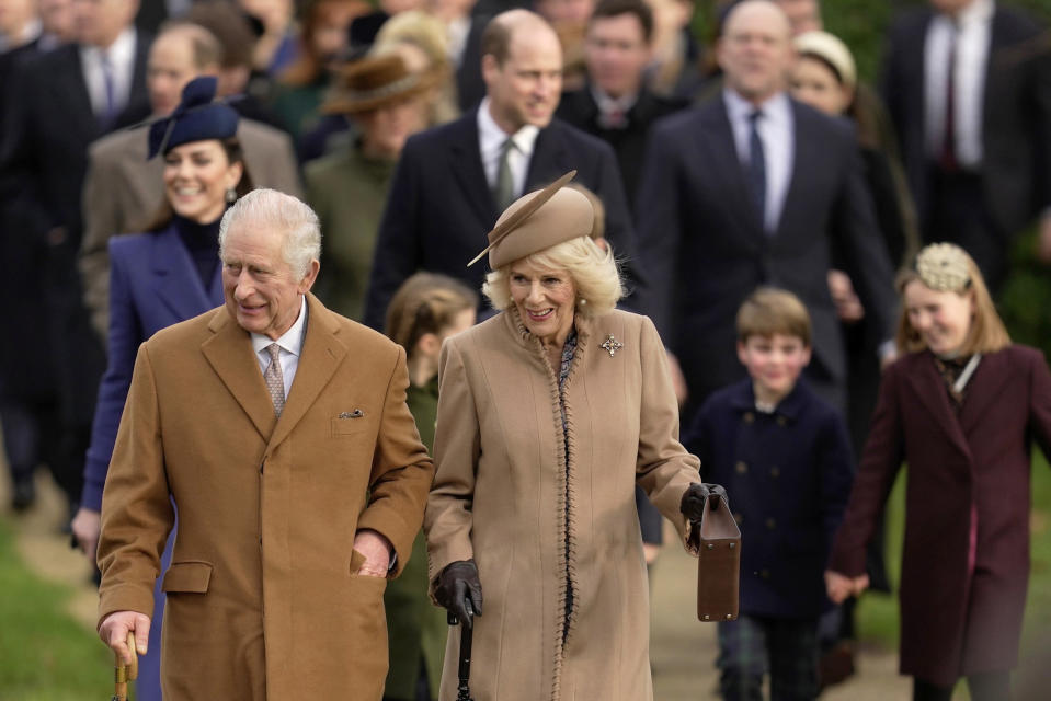 FILE - Britain's King Charles III and Queen Camilla arrive to attend the Christmas day service at St Mary Magdalene Church in Sandringham in Norfolk, England on Dec. 25, 2023. Upon receiving his first treatment for cancer, Britain's King Charles III retreated to Sandringham House, a private estate. That's where the monarch has long taken refuge while walking and shooting along the windswept North Sea coast of eastern England. Sandringham, the private home of the last six British monarchs, sits amid parkland, gardens and working farms about 110 miles (180 kilometers) north of London. (AP Photo/Kin Cheung, File)