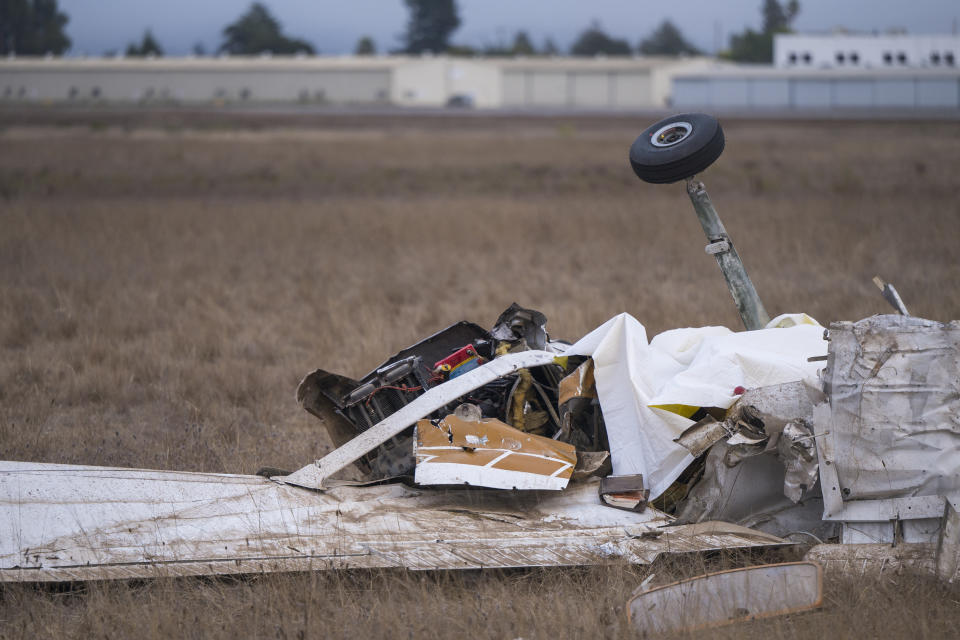 Wreckage from a plane crash is seen at Watsonville Municipal Airport in Watsonville, Calif., Thursday, Aug. 18, 2022. (AP Photo/Nic Coury)