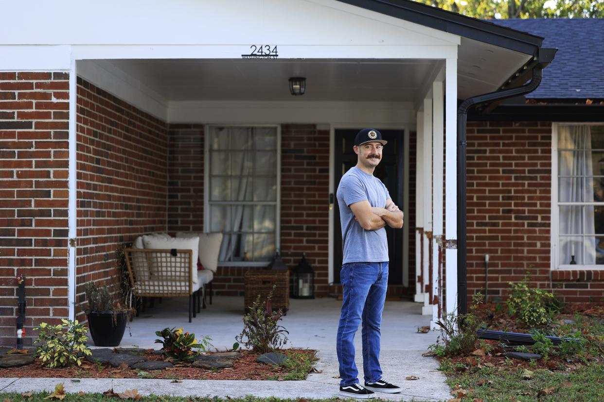 Christopher Goodyear is shown in portrait Monday at his home in Orange Park. The 32-year-old firefighter, paramedic and Navy veteran recently secured his home through the Veterans Affairs (VA) loan program.