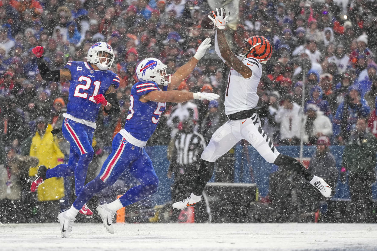 Jan 22, 2023; Orchard Park, New York, USA; Cincinnati Bengals wide receiver Ja'Marr Chase (1) makes a leaping catch in the end zone before an official review overturned a touchdown call in the second quarter of the NFL divisional playoff football game between the Cincinnati Bengals and the Buffalo Bills during an AFC divisional round game at Highmark Stadium. Mandatory Credit: Sam Greene-USA TODAY Sports