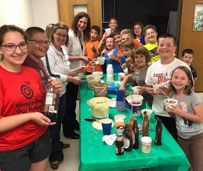 Members of the Pilsen Skylighters 4-H Club in Kewaunee County show off their ice cream making skills at an ice cream social they held last October. The club's ice cream skills extend further, as their suggestion for Cow Lick Ice Cream was named the Grand Prize winner in Cedar Crest  Ice Cream's annual Flavor Creation Contest for 4-H clubs across Wisconsin. It will be served at ice cream shops across the Midwest in July.