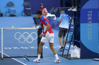 Novak Djokovic, of Serbia, breaks his racket during the bronze medal match of the tennis competition against Pablo Carreno Busta, of Spain, at the 2020 Summer Olympics, Saturday, July 31, 2021, in Tokyo, Japan. (AP Photo/Seth Wenig)