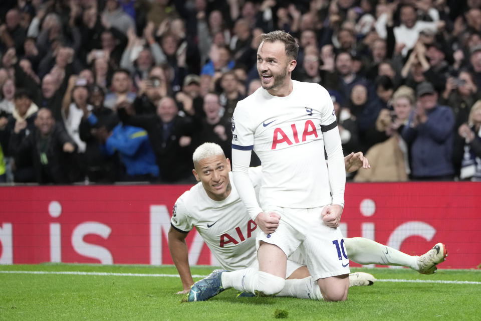 Tottenham's James Maddison, right, celebrates after scoring his side's second goal during the English Premier League soccer match between Tottenham Hotspur and Fulham at the Tottenham Hotspur Stadium in London, Monday, Oct. 23, 2023. (AP Photo/Kin Cheung)