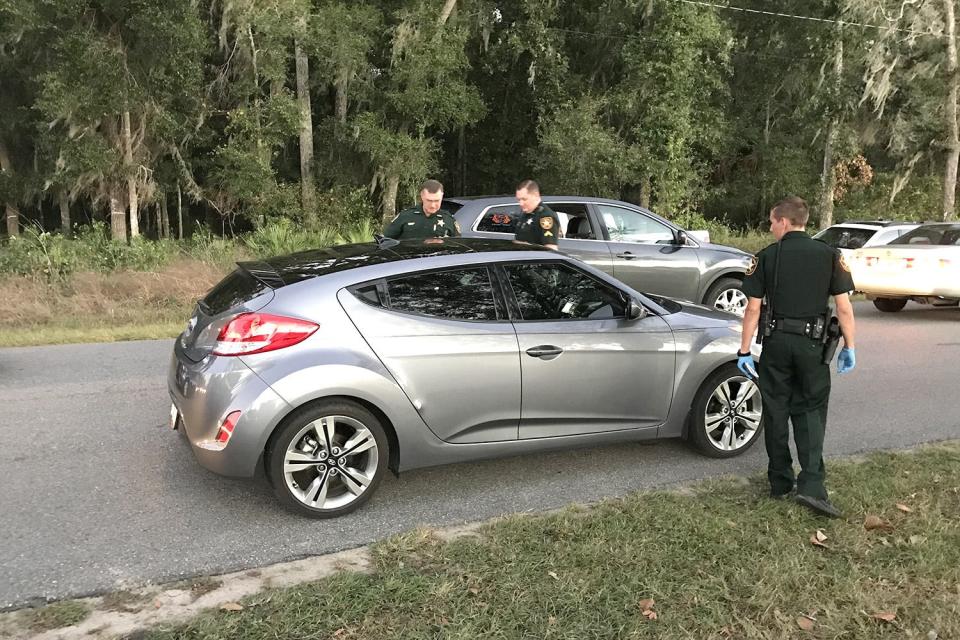 This file photo shows Marion County Sheriff's Office deputies investigating Brandon Hammett's shooting.