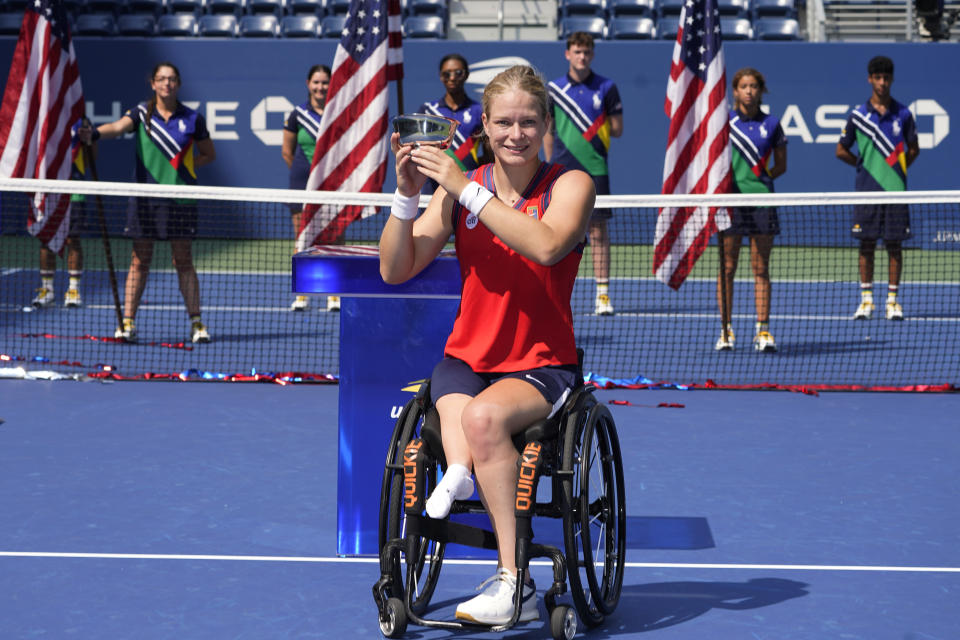 Diede De Groot, of the Netherlands, holds the championship trophy after her victory over Yui Kamiji, of Japan, in the women's wheelchair singles final at the US Open tennis championships, Sunday, Sept. 12, 2021, in New York. (AP Photo/Elise Amendola)