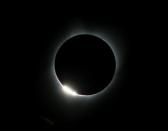 Total solar eclipse begins on US West Coast