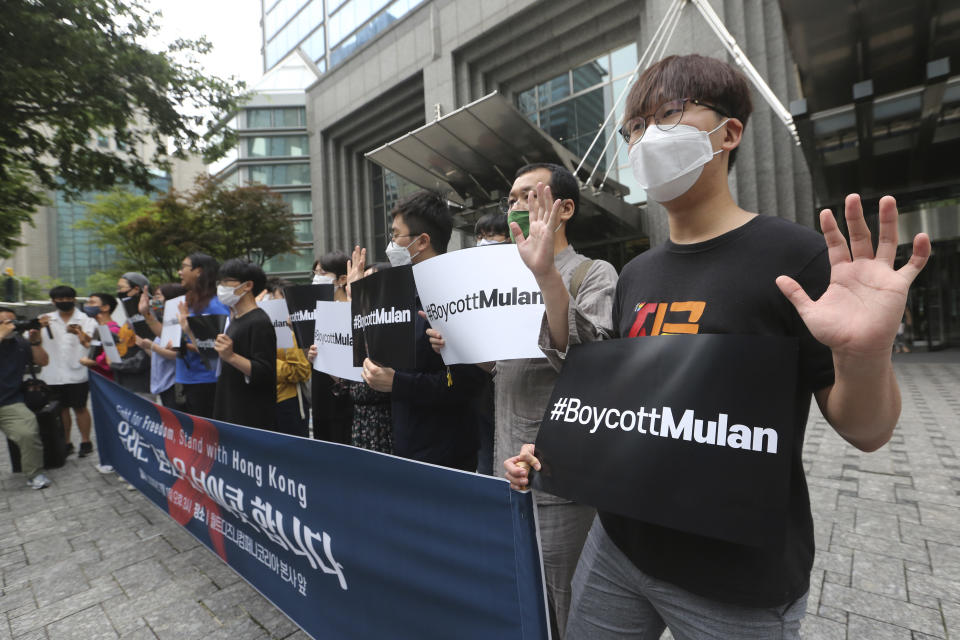 Supporters of Hong Kong protesters stage a rally calling for a boycott of the Disney-produced film "Mulan" outside Walt Disney Korea office in Seoul, South Korea, Wednesday, July 1, 2020. About a dozen protesters gathered to urge South Korean citizens to boycott film "Mulan" and criticize the Chinese government's Hong Kong national security law.(AP Photo/Ahn Young-joon)