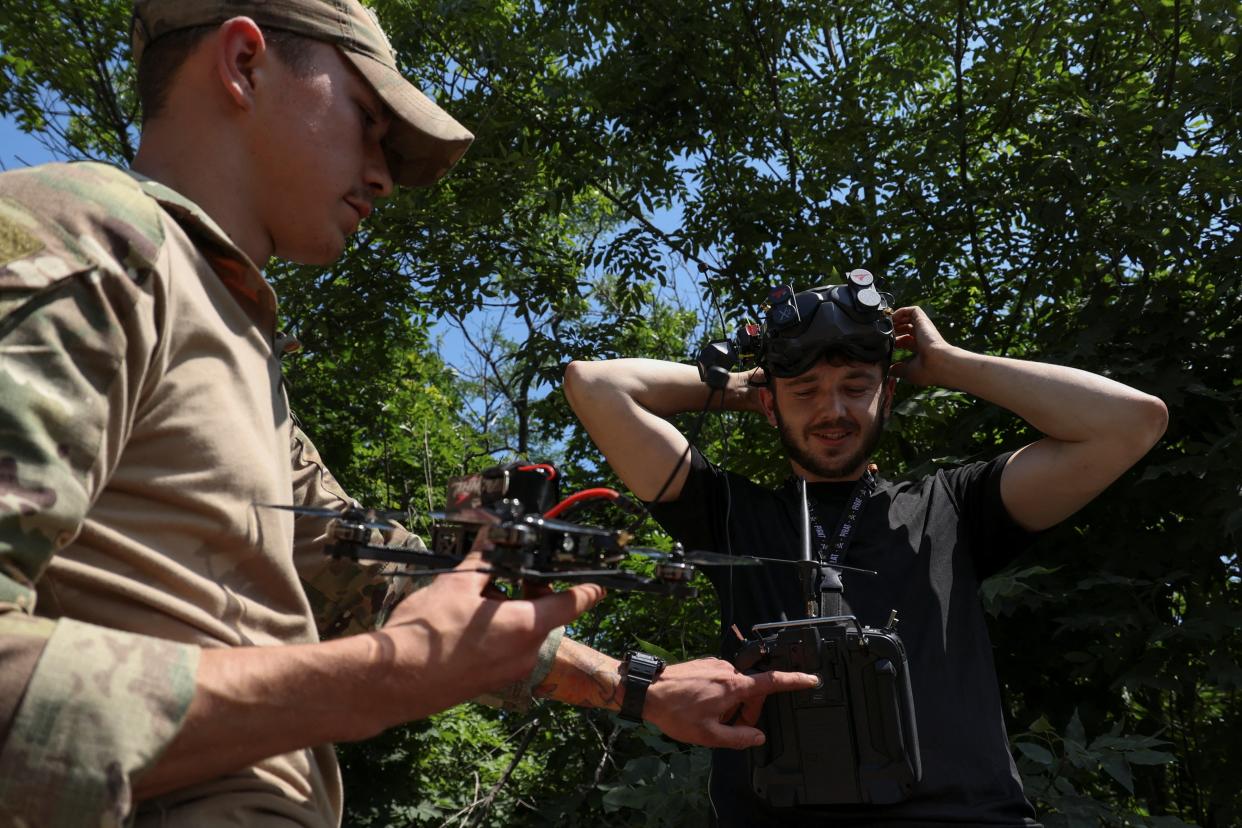 Ukrainian servicemen of the 35th Separate Marines Brigade prepare to launch a FPV drone at a training ground (REUTERS)