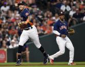 Houston Astros shortstop Carlos Correa, left, throws out Chicago White Sox's Tim Anderson as third baseman Robel Garcia, right, watches during the fifth inning of a baseball game, Saturday, June 19, 2021, in Houston. (AP Photo/Eric Christian Smith)