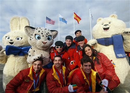 Members of the Spanish Olympic Team pose with an Olympic mascot during the welcoming ceremony for the team in the Athletes Village at the Olympic Park ahead of the 2014 Winter Olympic Games in Sochi February 6, 2014. REUTERS/Laszlo Balogh