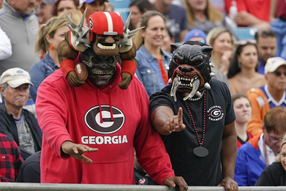 Georgia fans cheer on their team during the first half of an NCAA college football game against Florida, Saturday, Oct. 29, 2022, in Jacksonville, Fla. (AP Photo/John Raoux)