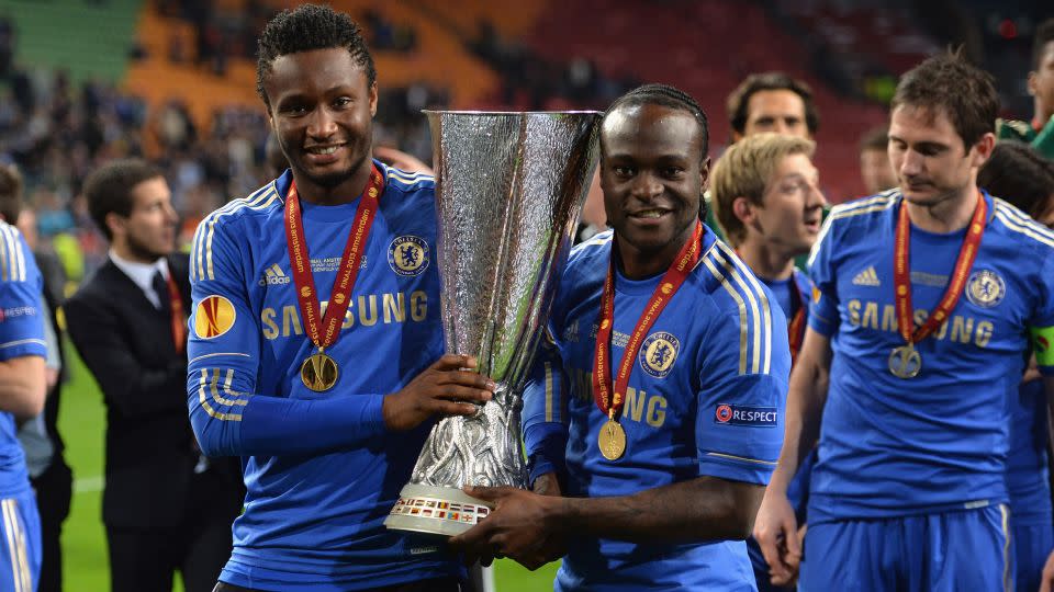 Obi, with his Nigeria international teammate Victor Moses, celebrates winning the Europa League in 2013. - Darren Walsh/Chelsea FC/Getty Images