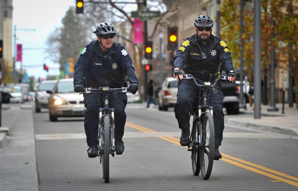 Bike patrol members of the Downtown Fresno Police Unit, T.J. Moore, left, and Sgt. Alfonso Castillo, patrol Fulton Street in downtown, Feb. 28, 2019.