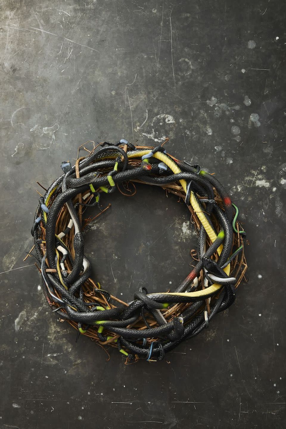 <p>A wreath can serve as the perfect foundation for a centerpiece. Guests will certainly freak out over this twig design that's decked out in plastic snakes. </p><p><a class="link " href="https://go.redirectingat.com?id=74968X1596630&url=https%3A%2F%2Fwww.michaels.com%2F18in-grapevine-wreath-by-ashland%2F10375477.html&sref=https%3A%2F%2Fwww.goodhousekeeping.com%2Fholidays%2Fhalloween-ideas%2Fg33437890%2Fhalloween-table-decorations-centerpieces%2F" rel="nofollow noopener" target="_blank" data-ylk="slk:SHOP GRAPEVINE WREATH;elm:context_link;itc:0;sec:content-canvas">SHOP GRAPEVINE WREATH</a></p>