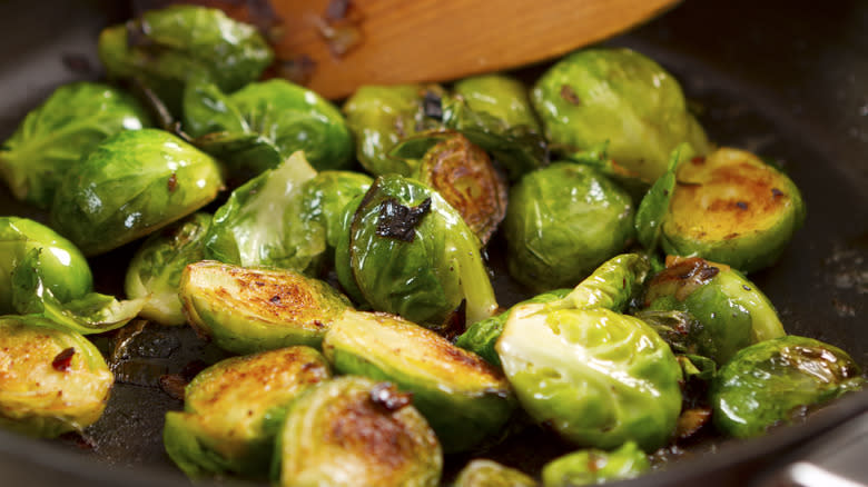 Brussels sprouts cooking in pan