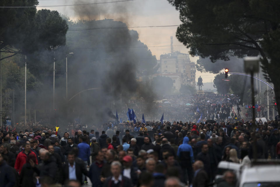 Protesters take part in an anti-government protest in Tirana, Albania, Saturday, April 13, 2019. Albanian opposition parties have returned to the streets for the first time since mid-February calling for the government's resignation and an early election, as the center-right opposition accuses the leftist Socialist Party government of Prime Minister Edi Rama of corruption and links to organized crime, which the government denies. (AP Photo/Visar Kryeziu)