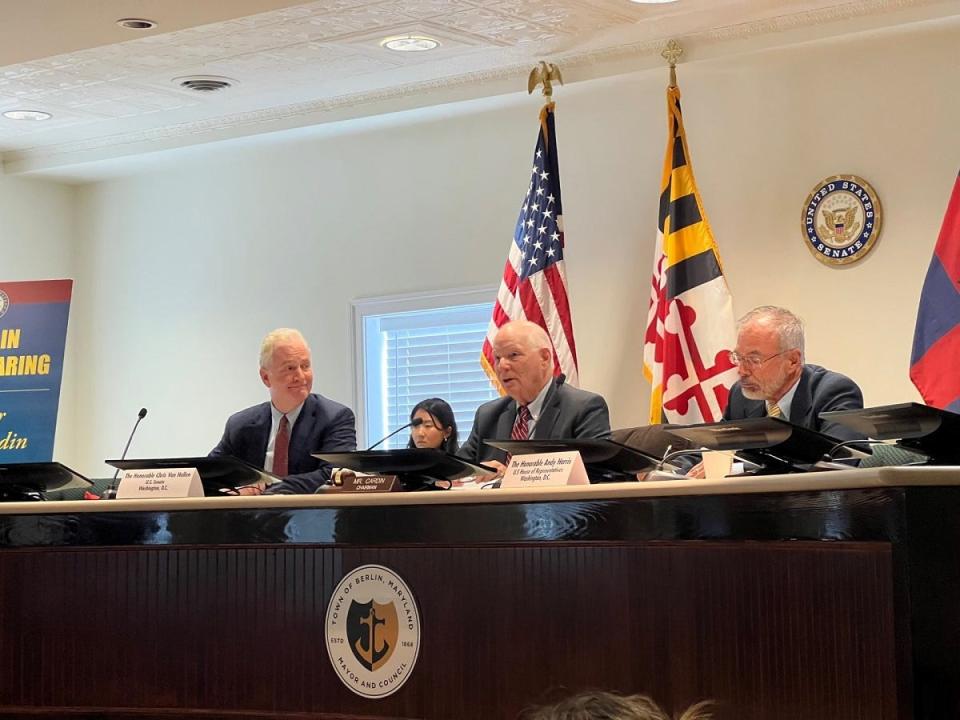 U.S. Sens. Chris Van Hollen and Ben Cardin, D-Md., left and center, respectively, meet in the town council chambers of Berlin, Maryland on August 17, 2023 to discuss small businesses. U.S. Rep. Andy Harris, at right, a Republican whose district includes Berlin, takes notes.