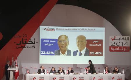 Chafik Sarsar (L), head of the Independent Election Commission (ISIE), addresses a news conference in Tunis November 25, 2014. REUTERS/Zoubeir Souissi