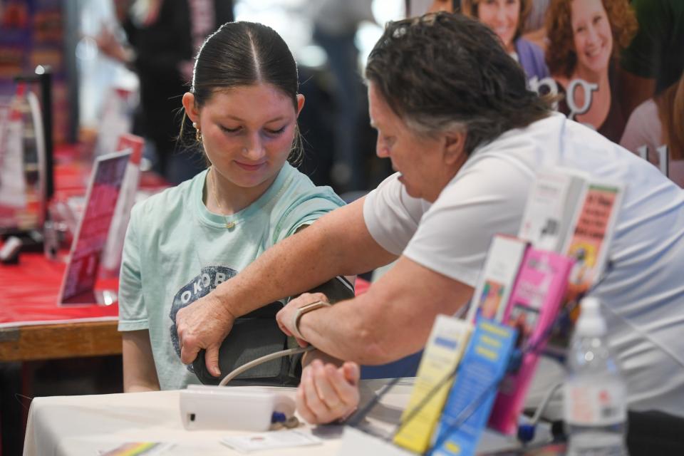 Middle school student Kyndle Paquette gets her blood pressure taken by Health Connect’s Executive Director Fran Rice on Wednesday, March 6, 2024 inside The Hub at Southeast Technical College in Sioux Falls.