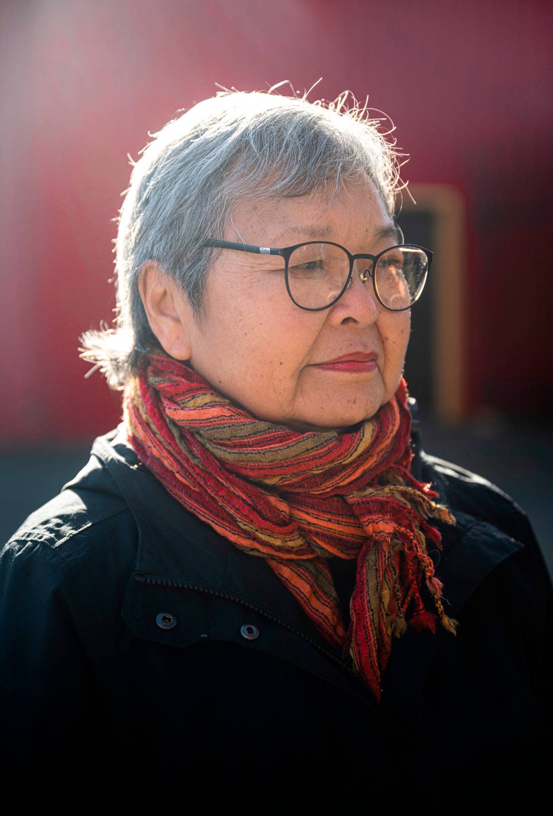 Mary Tanaka Abo, 82, poses for a portrait next to the statue, “Harmony,” that was created by Japanese American artist George Tsutakawa, to honor the people of Japanese ancestry that were incarcerated on the Washington State Fair grounds in Puyallup, Wash. during WWII, on Feb. 1, 2023. Abo was two-years-old when she and her family were forced to live at the camp after being removed from their home in Juneau, Alaska in 1942. The Puyallup Valley Japanese American Citizens League plans to build a remembrance gallery under the grandstands of the Washington State Fair to honor all of the Japanese American people who were incarcerated at the “Puyallup Assembly Center” or “Camp Harmony” during WWII.