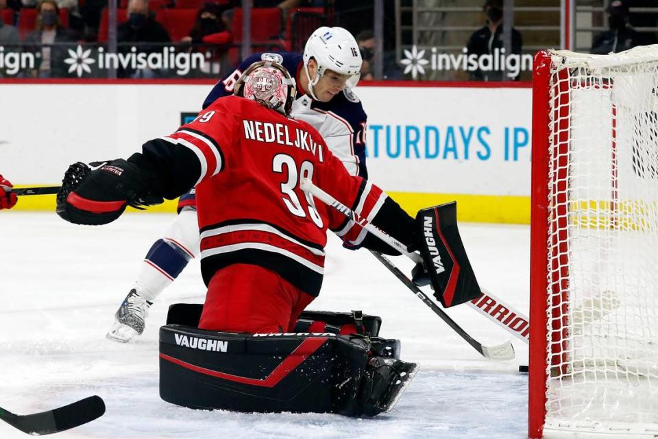 Columbus Blue Jackets’ Max Domi (16) slips the puck past Carolina Hurricanes goaltender Alex Nedeljkovic (39) for a goal during the first period of an NHL hockey game in Raleigh, N.C., Saturday, May 1, 2021. (AP Photo/Karl B DeBlaker)