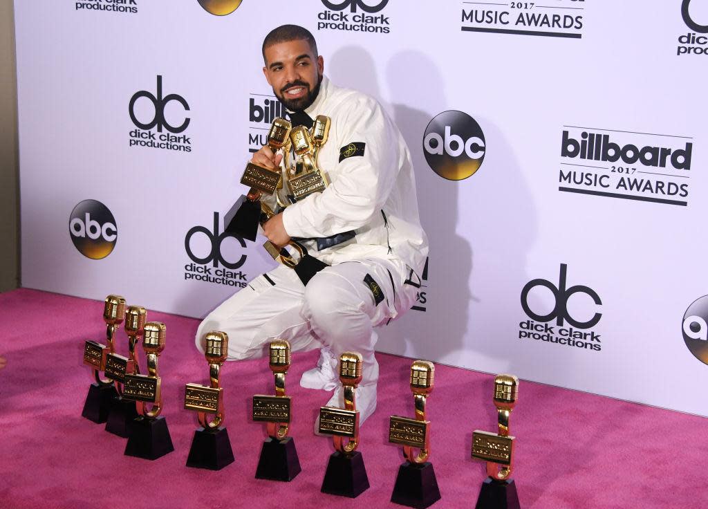 Drake poses with his 13 Billboard Music Awards: Mark Ralston/AFP/Getty Images