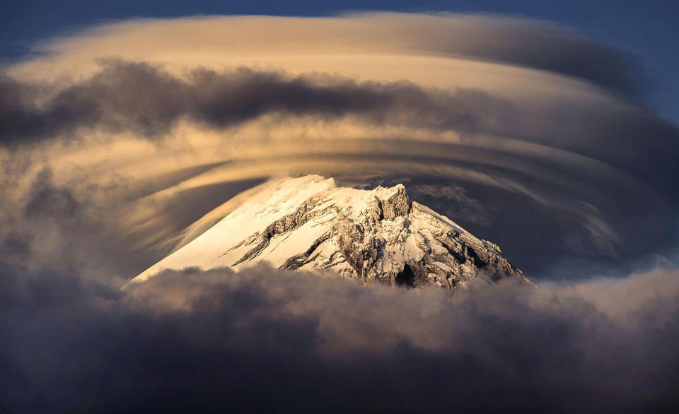 Stunning images capture ‘UFO’ clouds surrounding volcano 