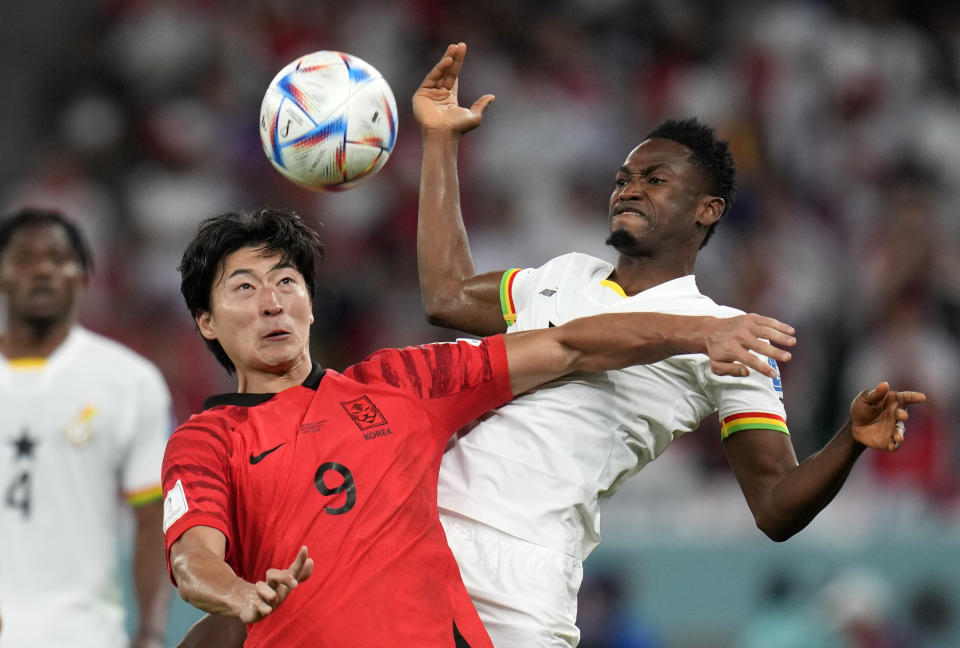 South Korea's Cho Gue-sung, left, duels for the ball with Ghana's Abdul Rahman Baba during the World Cup group H soccer match between South Korea and Ghana, at the Education City Stadium in Al Rayyan, Qatar, Monday, Nov. 28, 2022. (AP Photo/Ricardo Mazalan)