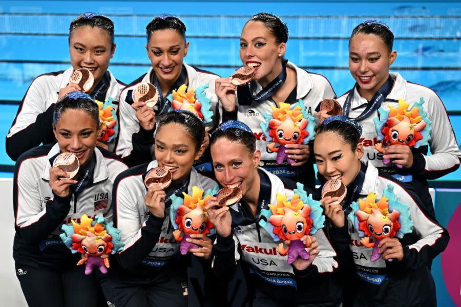 USA’s team bronze medallists pose after the medal ceremony at the end of the final of the team free artistic swimming event during the 2024 World Aquatics Championships at Aspire Dome in Doha on February 9, 2024. (Photo by MANAN VATSYAYANA/AFP via Getty Images)