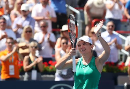 Aug 11, 2018; Montreal, Quebec, Canada; Simona Halep of Romania celebrates as she wins against Ashleigh Barty of Australia (not pictured) during the Rogers Cup tennis tournament at Stade IGA. Mandatory Credit: Jean-Yves Ahern-USA TODAY Sports