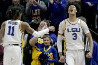 LSU forward Alex Fudge (3) reacts with guard Justice Williams (11) during the first half an NCAA college basketball game against Texas A&M in Baton Rouge, La., Wednesday, Jan. 26, 2022. (AP Photo/Matthew Hinton)