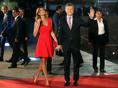 Argentine President Mauricio Macri and First Lady Juliana Awada arrive for the inauguration of the VIII Summit of the Americas in Lima, Peru April 13, 2018. REUTERS/Marcos Brindicci