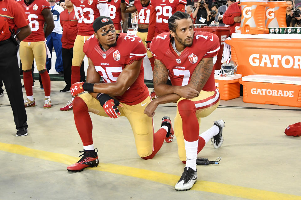 Colin Kaepernick (right) was joined by San Francisco 49er teammate Eric Reid in taking a knee to protest racial injustice as the national anthem played prior to the start of a regular season game against the Los Angeles Rams in Santa Clara, California, in September 2016. (Photo: Thearon W. Henderson via Getty Images)