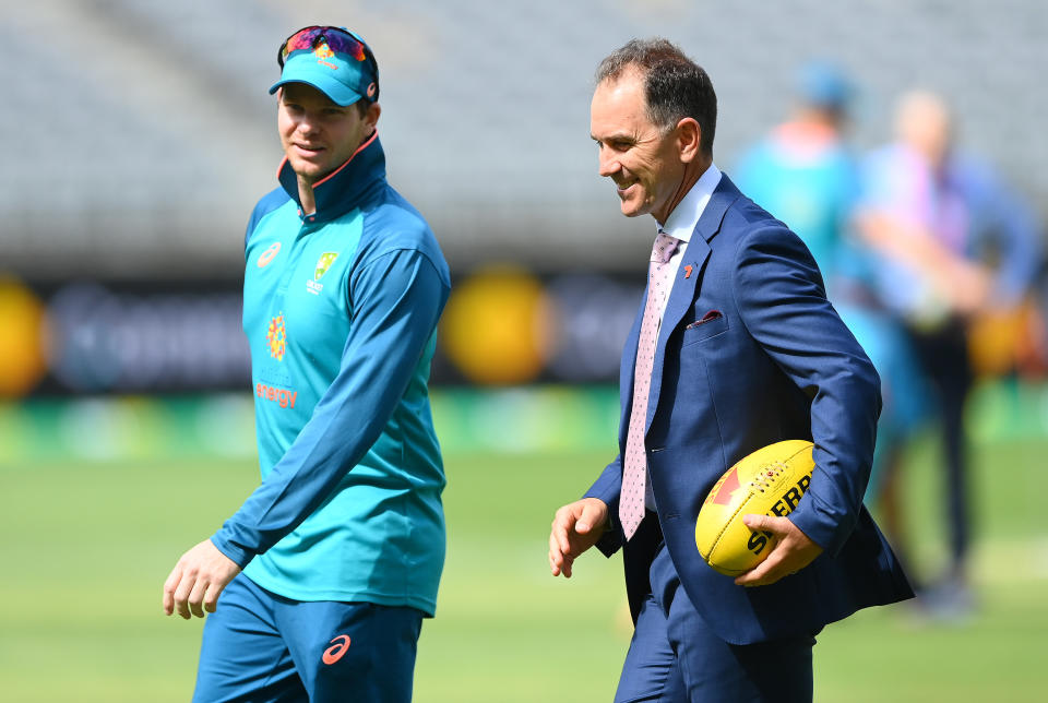 Justin Langer, pictured here speaking to Steve Smith ahead of the first Test between Australia and West Indies in November.