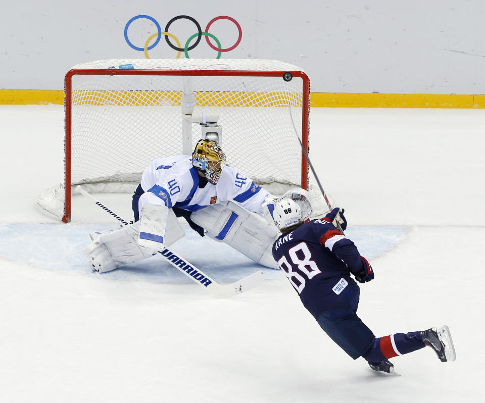 FILE - USA forward Patrick Kane hits the post as he shoots on Finland goaltender Tuukka Rask during the second period of the men's bronze medal ice hockey game at the 2014 Winter Olympics, Feb. 22, 2014, in Sochi, Russia. (AP Photo/David J. Phillip, File)