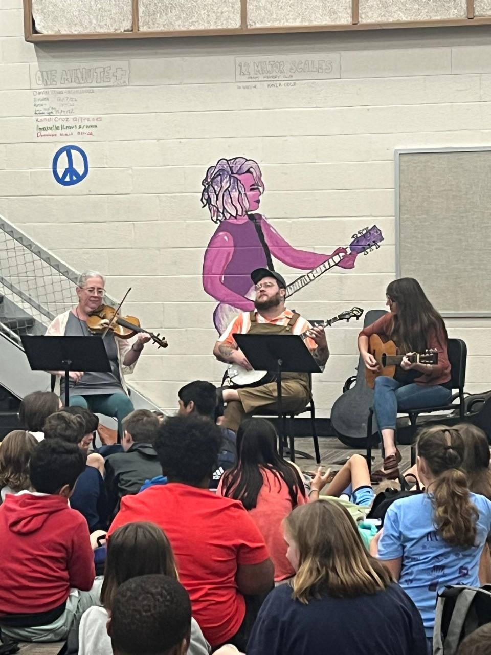 Sarah Pirkle’s group performs Sept. 18, 2023, for students and faculty at Gresham Middle School. The school performances aim at recruiting for the fall session of Junior Appalachian Musicians.