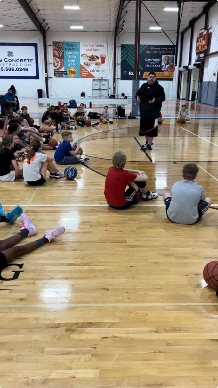 Legacy Courts co-owner and Indiana Ice founder Dustin Harvey speaks to children during a camp at Legacy Courts in Lafayette.