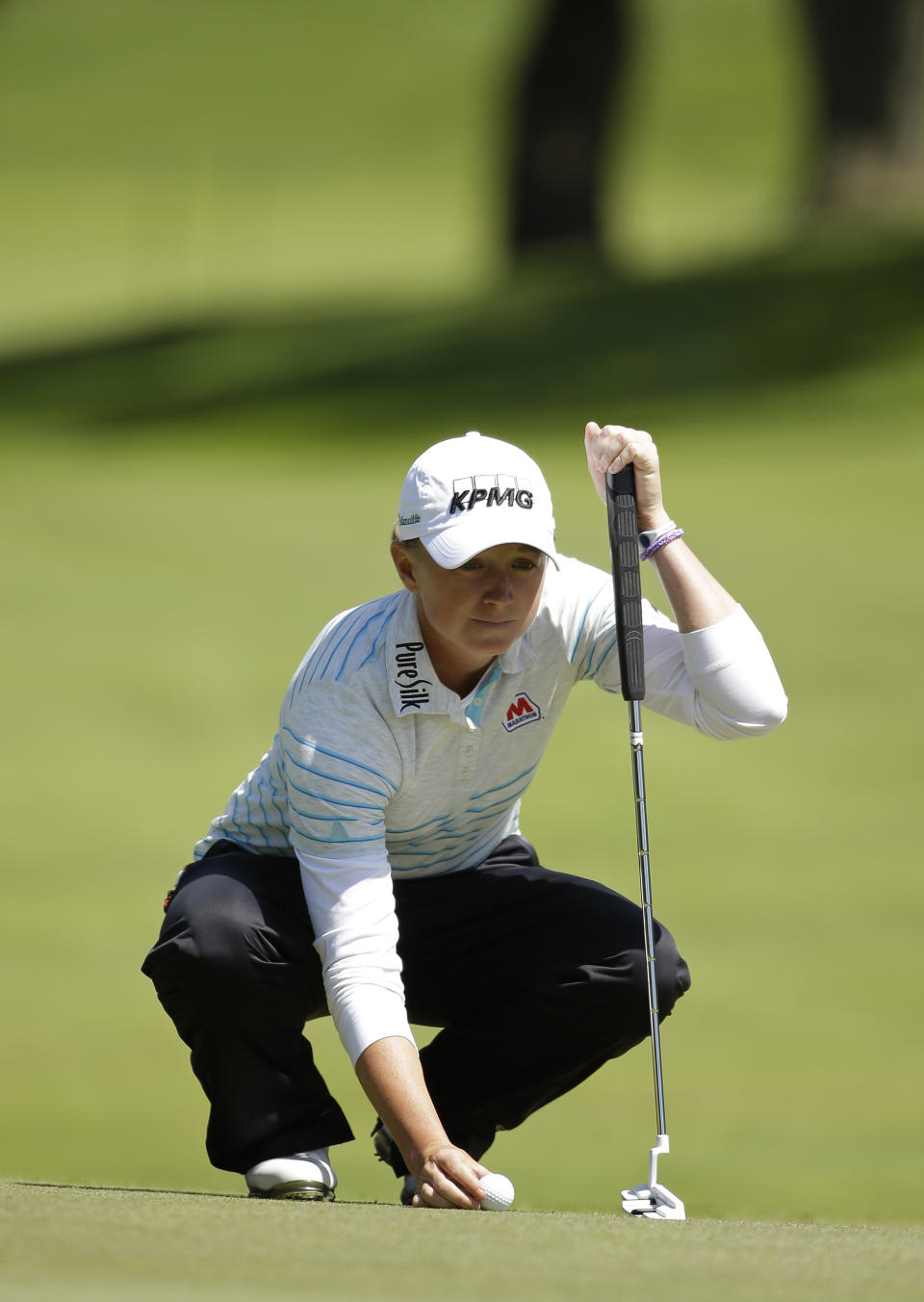 Stacy Lewis lines up a putt on the fifth green of Lake Merced Golf Club during the final round of the Swinging Skirts LPGA Classic golf tournament on Sunday, April 27, 2014, in Daly City, Calif. (AP Photo/Eric Risberg)