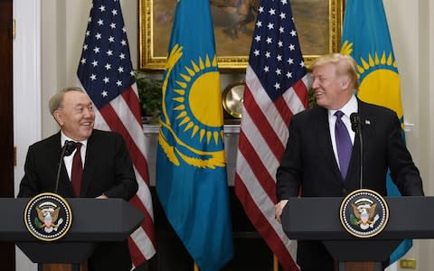 Mr Nazarbayev appears with Donald Trump in the White House on Tuesday. He has tried to balance relations with the United States, Russia and China - Credit: Olivier Douliery/Pool via Bloomberg