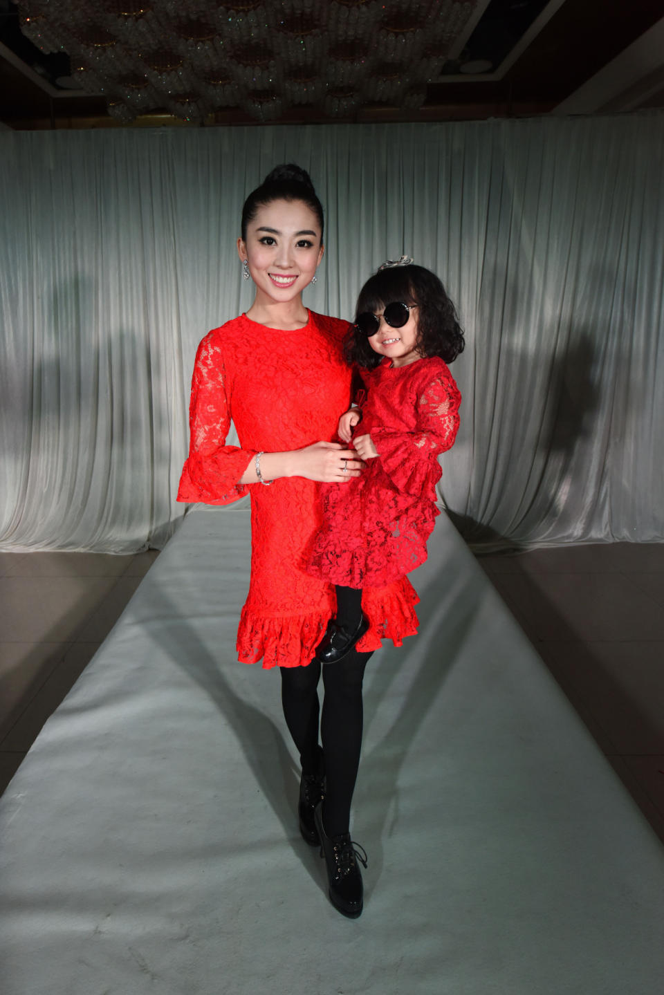 If this wasn’t a fake fashion show in China, one could assume they were taking part in Dolce & Gabbana’s most recent runway show that celebrated families. But, alas, this pair just threw their own over-the-top fashion party.